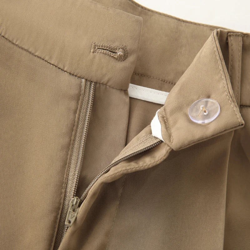 Made from lightweight, breathable fabric, it features a palazzo-style silhouette that elongates the silhouette, a high waistband that accentuates the waist, and an impeccable fit that guarantees sophistication for any occasion.