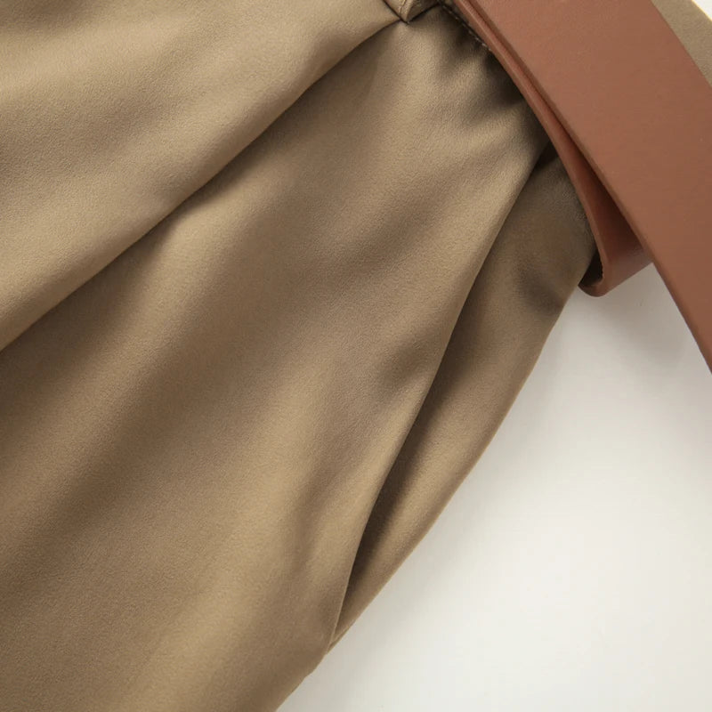 Made from lightweight, breathable fabric, it features a palazzo-style silhouette that elongates the silhouette, a high waistband that accentuates the waist, and an impeccable fit that guarantees sophistication for any occasion.