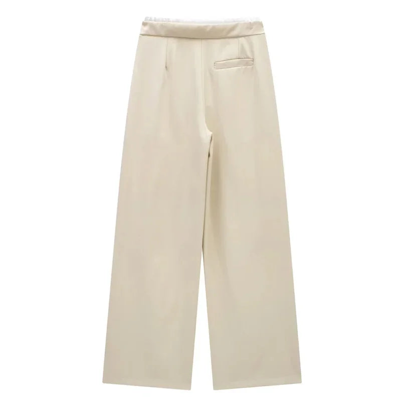 Made from soft, breathable fabric, it features a loose fit that elongates the silhouette, a high waist with drawstring adjustment, and a loose fit for maximum comfort. Ideal for casual looks, work, or leisure.
