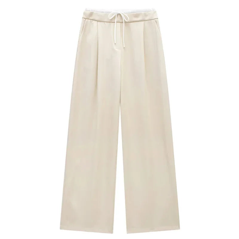 Made from soft, breathable fabric, it features a loose fit that elongates the silhouette, a high waist with drawstring adjustment, and a loose fit for maximum comfort. Ideal for casual looks, work, or leisure.