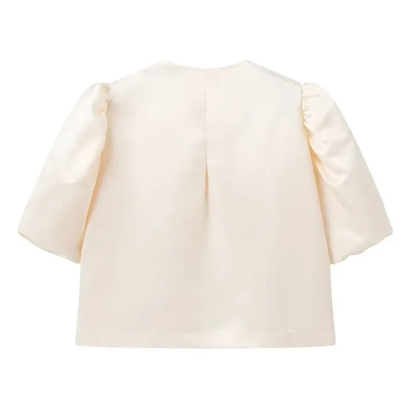 Dress in elegance, crafted from premium fabric, featuring modern puff sleeves, impeccable finish, and a cut that flatters the feminine silhouette. Perfect for versatile combinations—from workwear to special occasions.