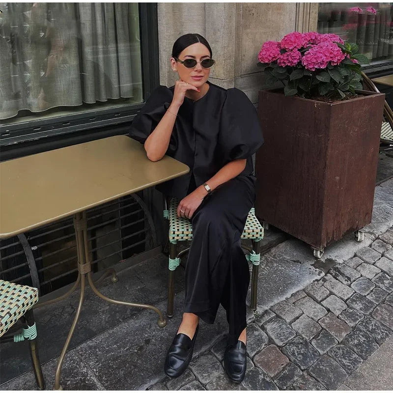 Dress in elegance, crafted from premium fabric, featuring modern puff sleeves, impeccable finish, and a cut that flatters the feminine silhouette. Perfect for versatile combinations—from workwear to special occasions.