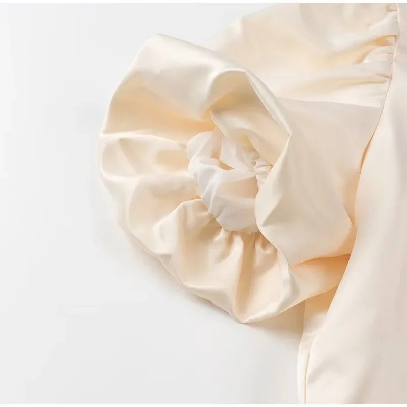 Dress in elegance, crafted from premium fabric, featuring modern puff sleeves, impeccable finish, and a cut that flatters the feminine silhouette. Perfect for versatile combinations—from workwear to special occasions.