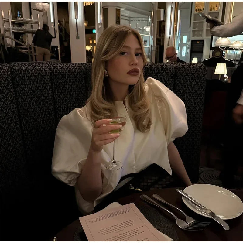 Dress in elegance, crafted from premium fabric, featuring modern puff sleeves, impeccable finish, and a cut that flatters the feminine silhouette. Perfect for versatile combinations—from workwear to special occasions.