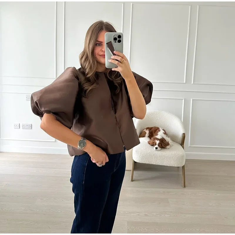 Dress in elegance, crafted from premium fabric, featuring modern puff sleeves, impeccable finish, and a cut that flatters the feminine silhouette. Perfect for versatile combinations—from workwear to special occasions.