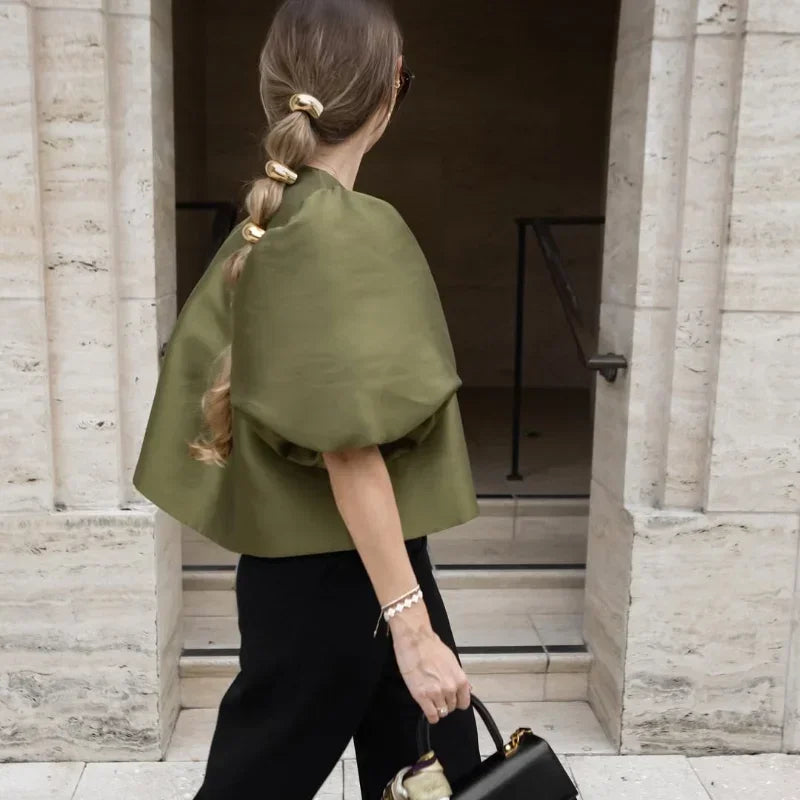 Dress in elegance, crafted from premium fabric, featuring modern puff sleeves, impeccable finish, and a cut that flatters the feminine silhouette. Perfect for versatile combinations—from workwear to special occasions.