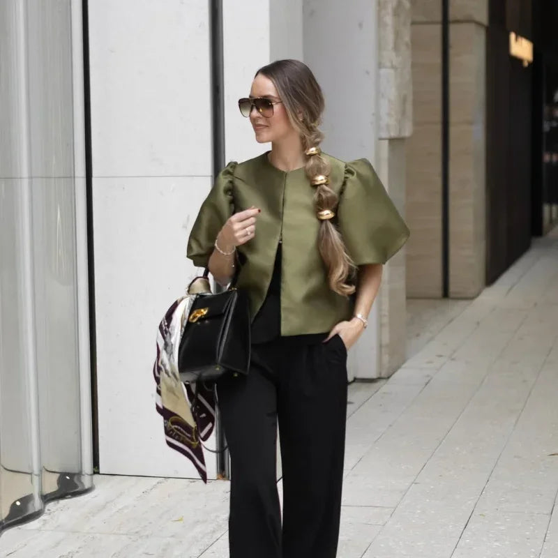 Dress in elegance, crafted from premium fabric, featuring modern puff sleeves, impeccable finish, and a cut that flatters the feminine silhouette. Perfect for versatile combinations—from workwear to special occasions.