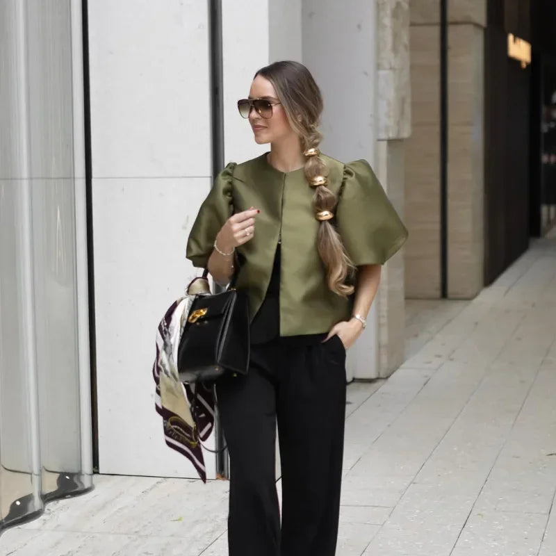 Dress in elegance, crafted from premium fabric, featuring modern puff sleeves, impeccable finish, and a cut that flatters the feminine silhouette. Perfect for versatile combinations—from workwear to special occasions.