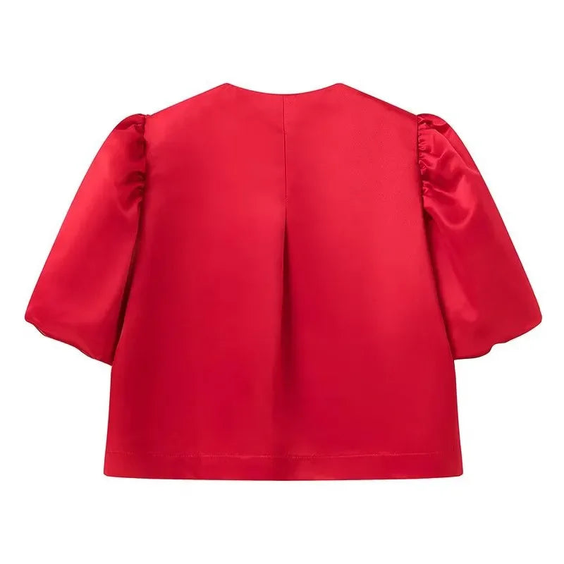 Dress in elegance, crafted from premium fabric, featuring modern puff sleeves, impeccable finish, and a cut that flatters the feminine silhouette. Perfect for versatile combinations—from workwear to special occasions.