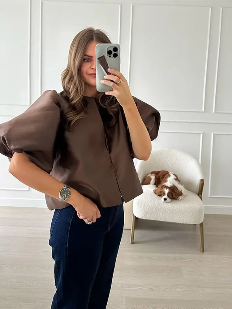 Dress in elegance, crafted from premium fabric, featuring modern puff sleeves, impeccable finish, and a cut that flatters the feminine silhouette. Perfect for versatile combinations—from workwear to special occasions.