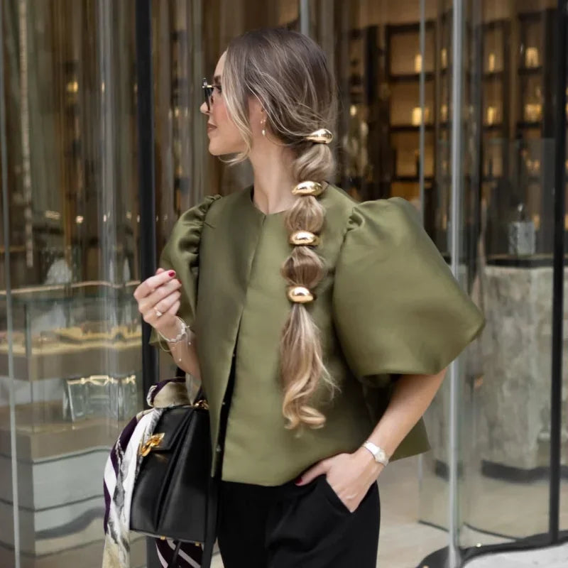 Dress in elegance, crafted from premium fabric, featuring modern puff sleeves, impeccable finish, and a cut that flatters the feminine silhouette. Perfect for versatile combinations—from workwear to special occasions.
