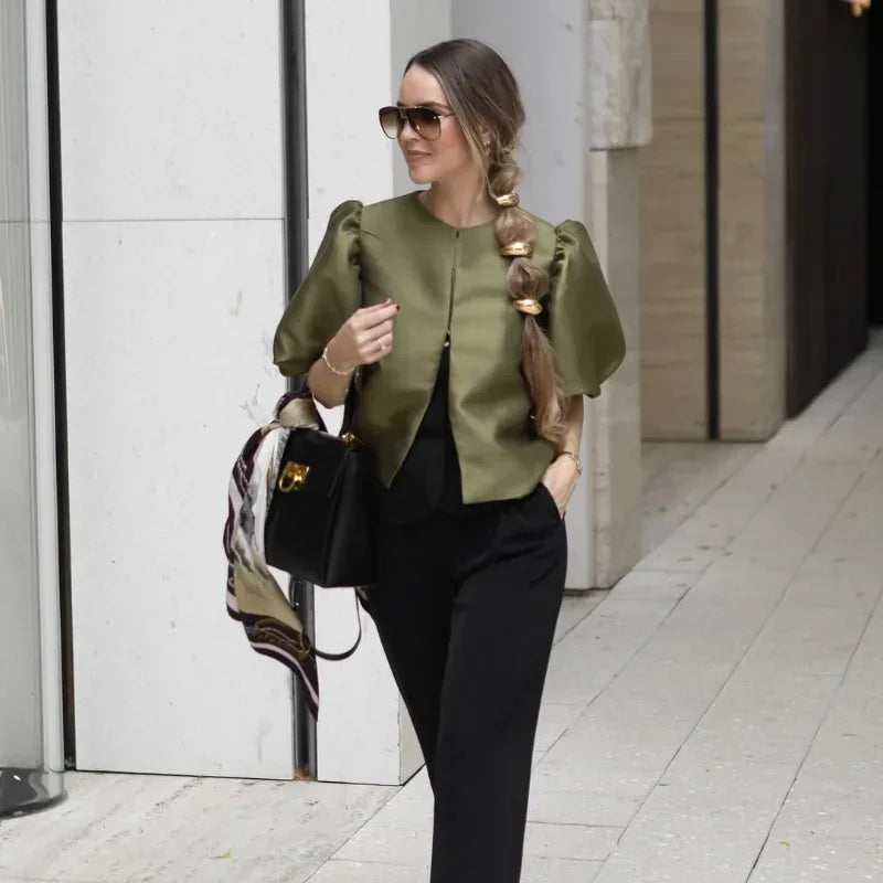 Dress in elegance, crafted from premium fabric, featuring modern puff sleeves, impeccable finish, and a cut that flatters the feminine silhouette. Perfect for versatile combinations—from workwear to special occasions.