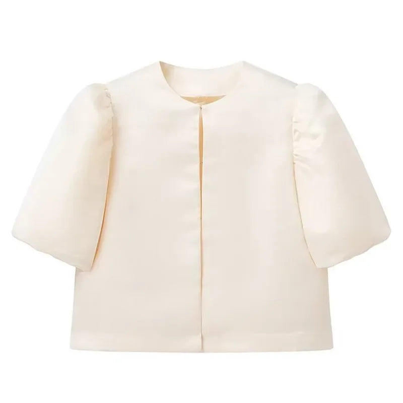 Dress in elegance, crafted from premium fabric, featuring modern puff sleeves, impeccable finish, and a cut that flatters the feminine silhouette. Perfect for versatile combinations—from workwear to special occasions.