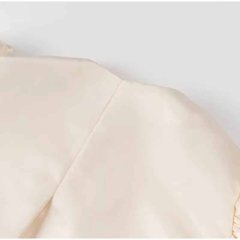 Dress in elegance, crafted from premium fabric, featuring modern puff sleeves, impeccable finish, and a cut that flatters the feminine silhouette. Perfect for versatile combinations—from workwear to special occasions.