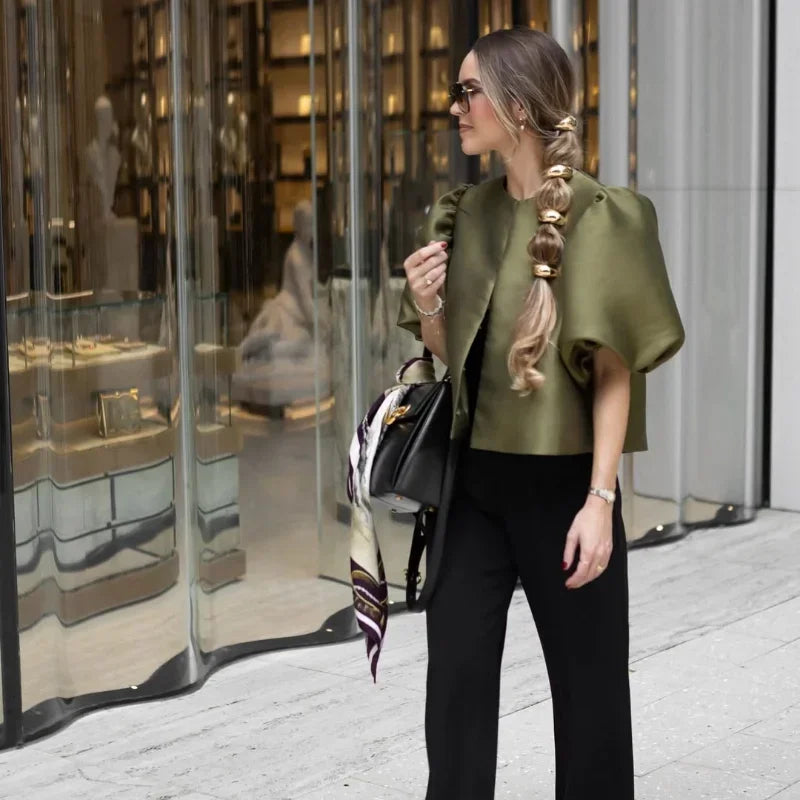 Dress in elegance, crafted from premium fabric, featuring modern puff sleeves, impeccable finish, and a cut that flatters the feminine silhouette. Perfect for versatile combinations—from workwear to special occasions.