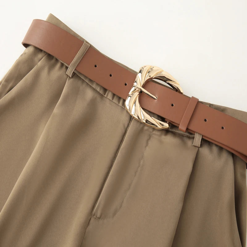 Made from lightweight, breathable fabric, it features a palazzo-style silhouette that elongates the silhouette, a high waistband that accentuates the waist, and an impeccable fit that guarantees sophistication for any occasion.