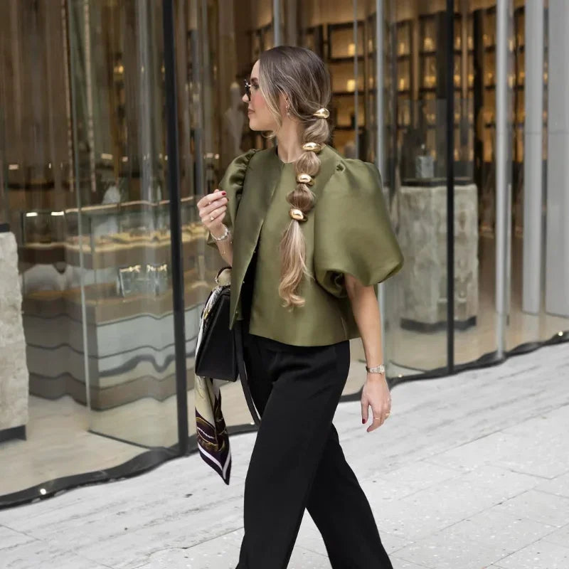 Dress in elegance, crafted from premium fabric, featuring modern puff sleeves, impeccable finish, and a cut that flatters the feminine silhouette. Perfect for versatile combinations—from workwear to special occasions.