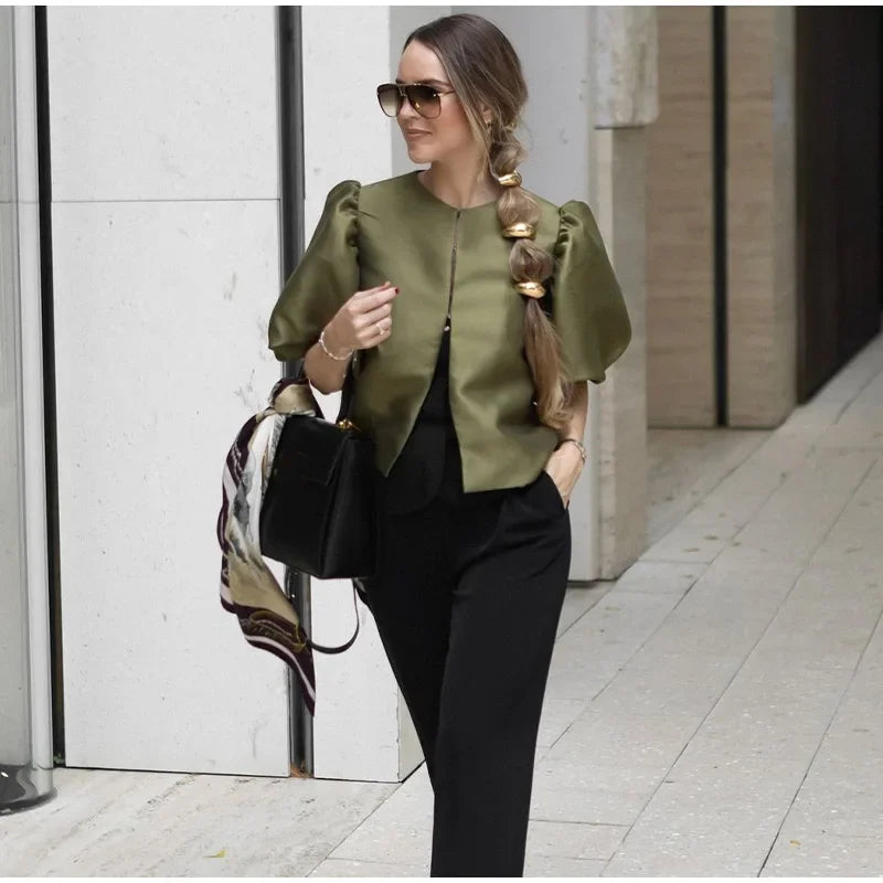 Dress in elegance, crafted from premium fabric, featuring modern puff sleeves, impeccable finish, and a cut that flatters the feminine silhouette. Perfect for versatile combinations—from workwear to special occasions.