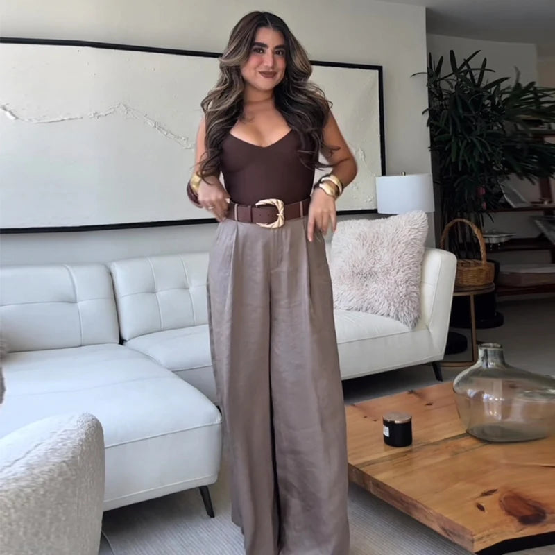 Made from lightweight, breathable fabric, it features a palazzo-style silhouette that elongates the silhouette, a high waistband that accentuates the waist, and an impeccable fit that guarantees sophistication for any occasion.